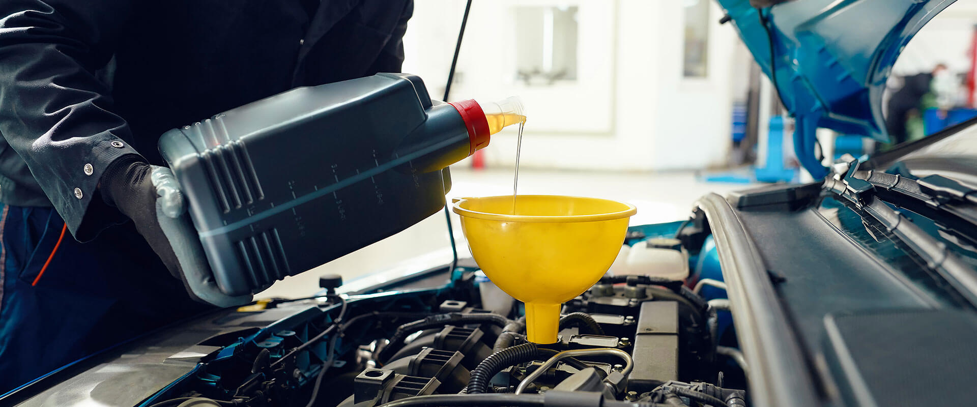 Oil change in progress at We-Fix-It Auto Repair in Tempe, AZ